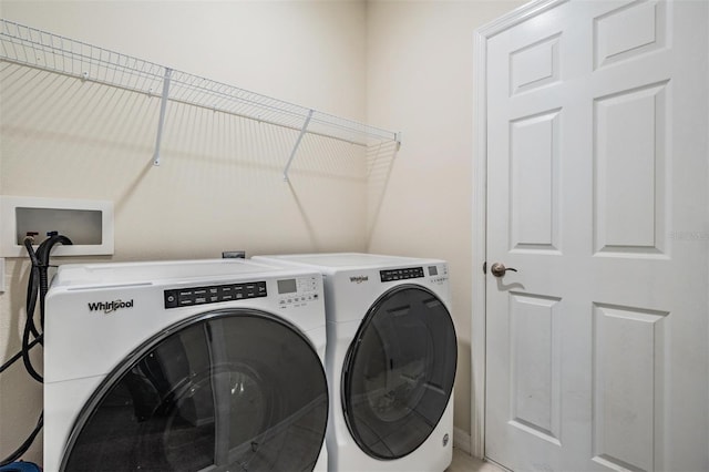 laundry area featuring washing machine and clothes dryer