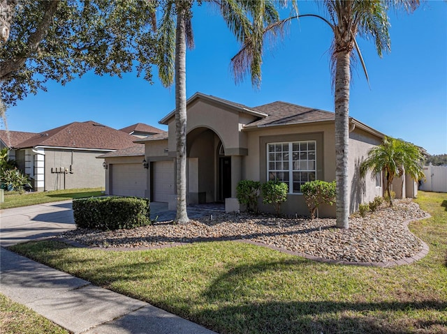 ranch-style home featuring a front yard and a garage