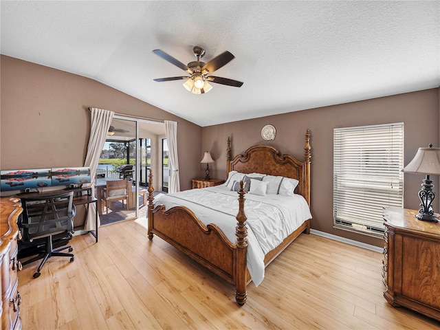 bedroom with ceiling fan, light wood-type flooring, access to outside, and lofted ceiling