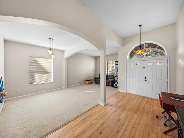 foyer entrance with light hardwood / wood-style floors