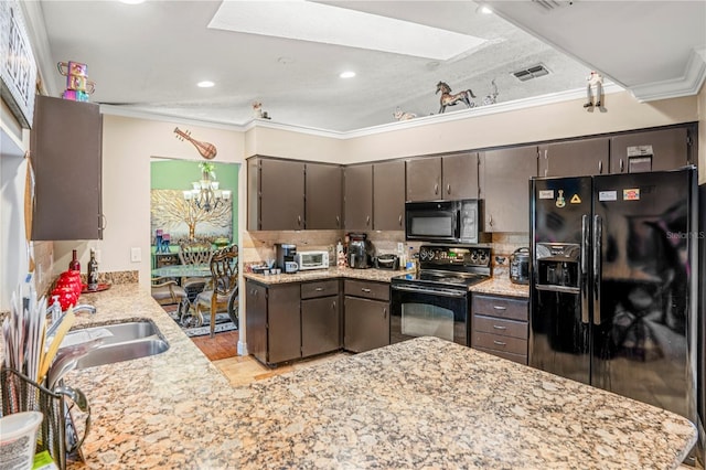 kitchen with black appliances, decorative backsplash, dark brown cabinetry, and crown molding