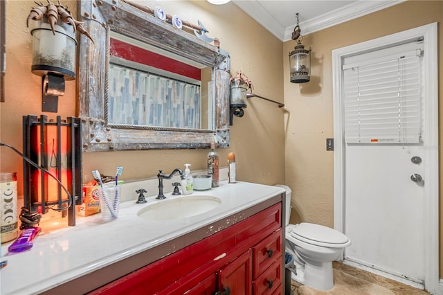 bathroom featuring vanity, toilet, and ornamental molding