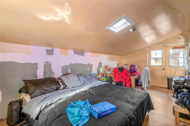 bedroom with vaulted ceiling with skylight