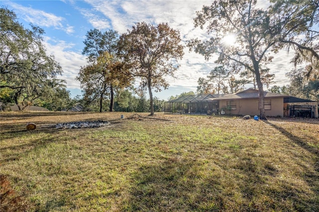 view of yard with a lanai