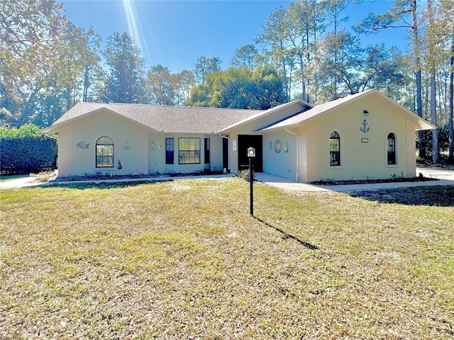 ranch-style home with a front yard