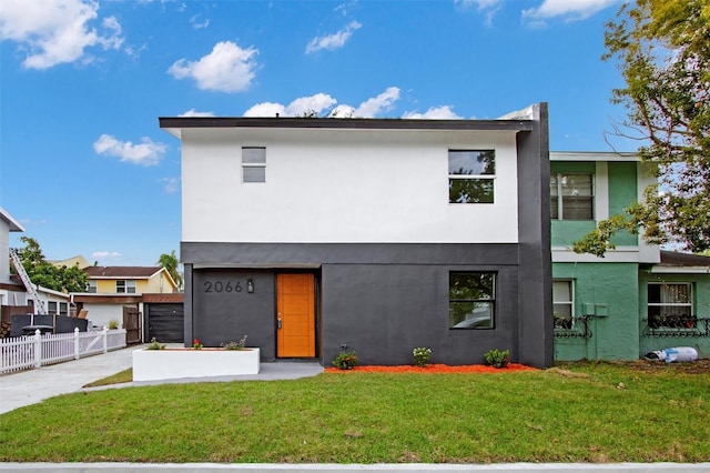 view of front of home with a front lawn