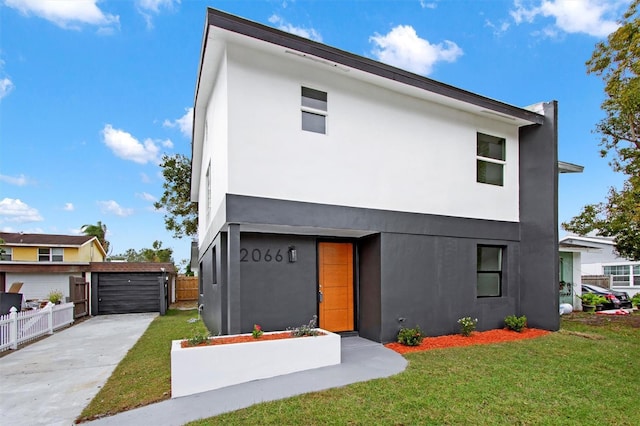 contemporary home with a front lawn