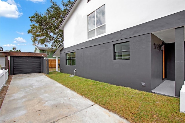 view of property exterior featuring a lawn