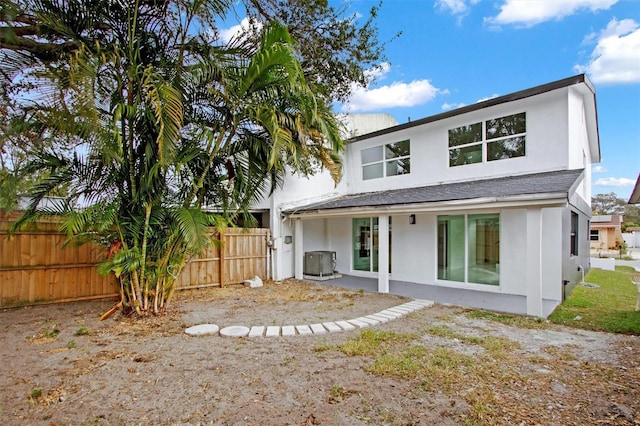 back of property with central AC unit