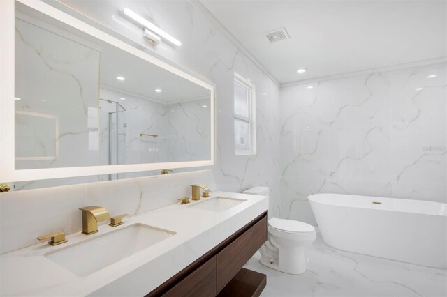 full bathroom with vanity, separate shower and tub, toilet, and tile walls