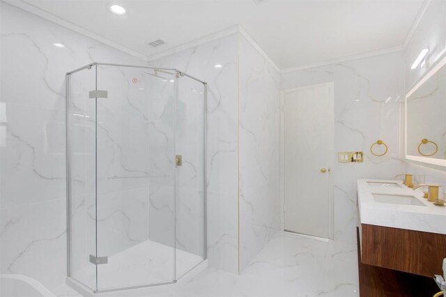 bathroom with vanity, ornamental molding, and a shower with door