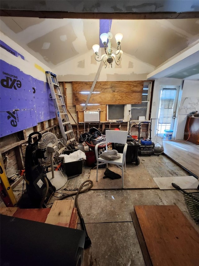 interior space featuring vaulted ceiling and a notable chandelier