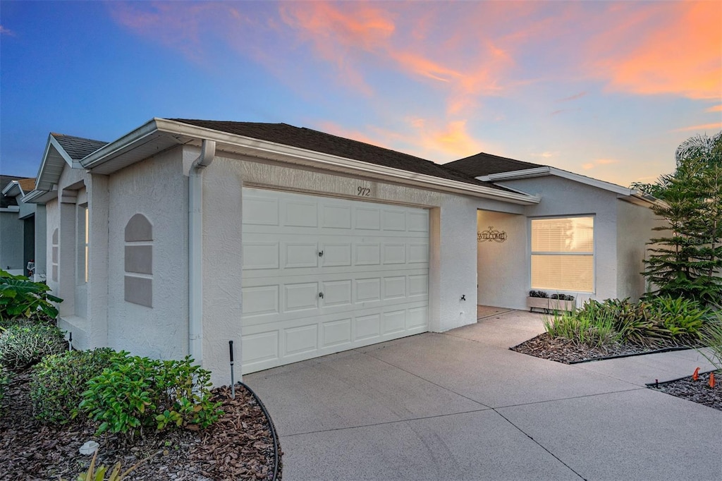 ranch-style home featuring a garage