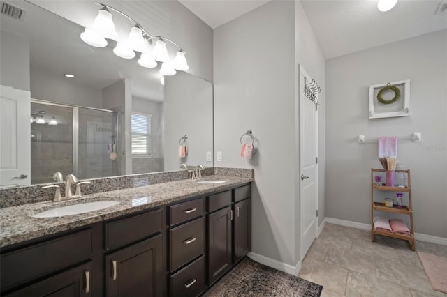 bathroom with vanity, tile patterned floors, and an enclosed shower