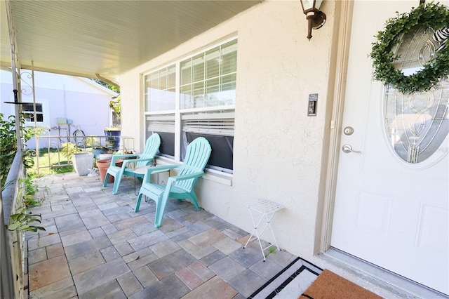 view of patio featuring a porch