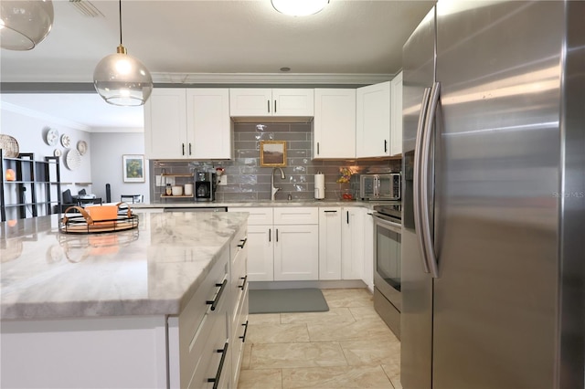 kitchen with light stone countertops, white cabinetry, stainless steel refrigerator, and range