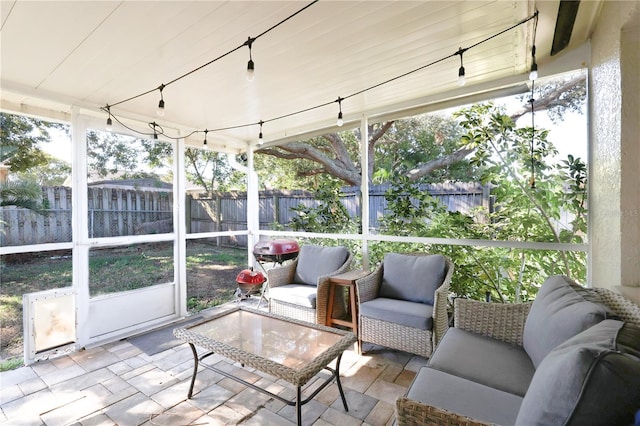 sunroom / solarium featuring wooden ceiling