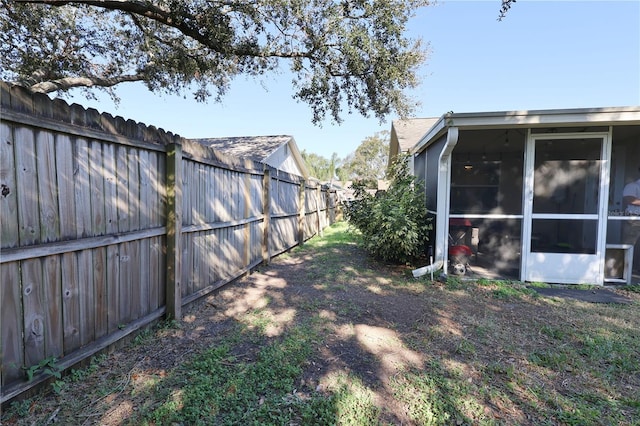 view of yard featuring a sunroom