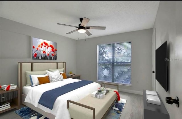 bedroom featuring ceiling fan, a textured ceiling, and hardwood / wood-style flooring