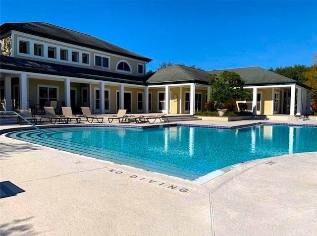 view of swimming pool featuring a patio