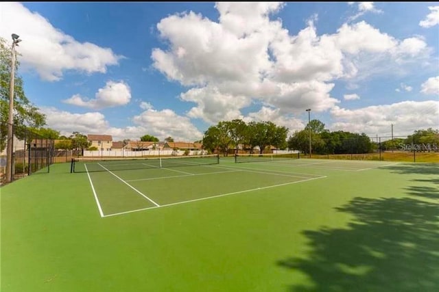 view of sport court with basketball hoop