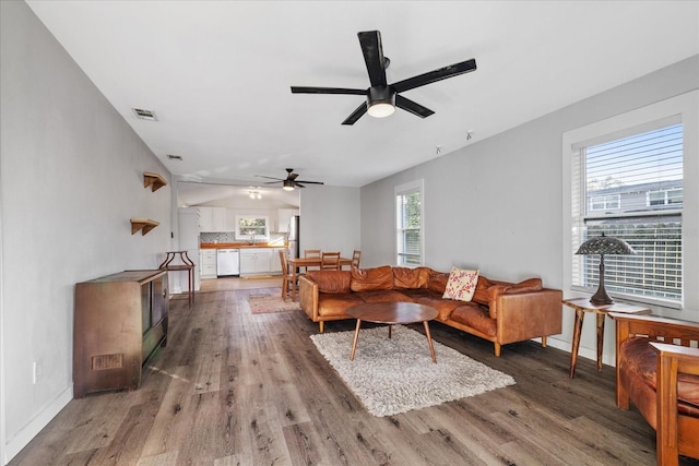 living room featuring hardwood / wood-style flooring and ceiling fan