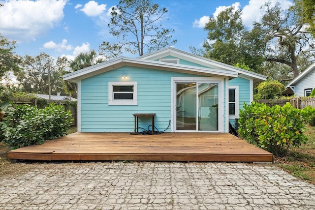 back of house featuring a deck