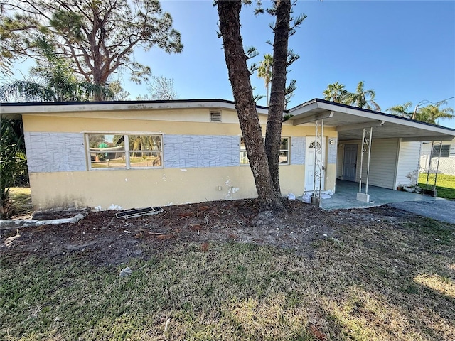 view of front of property with a carport