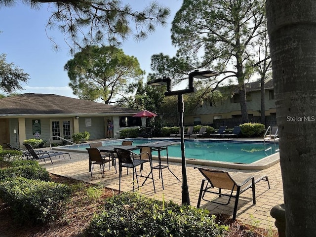 view of pool featuring a patio area