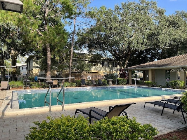 view of swimming pool featuring a patio