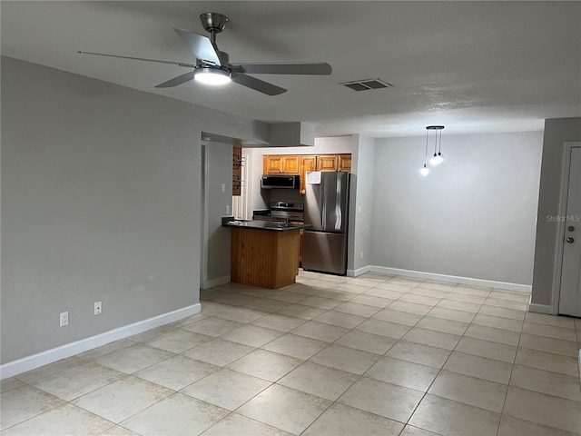 kitchen with light tile patterned flooring, pendant lighting, ceiling fan, kitchen peninsula, and stainless steel appliances