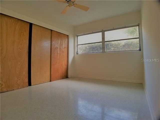 unfurnished bedroom with a closet and ceiling fan