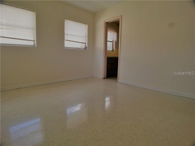 spare room with plenty of natural light