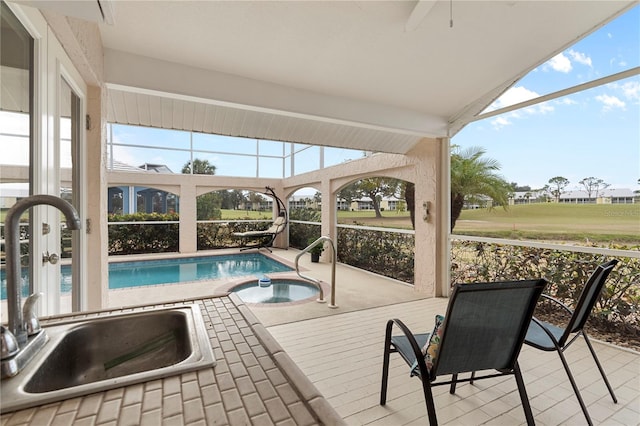 view of pool with sink and a patio area