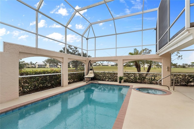 view of pool with an in ground hot tub, a lanai, sink, and a patio