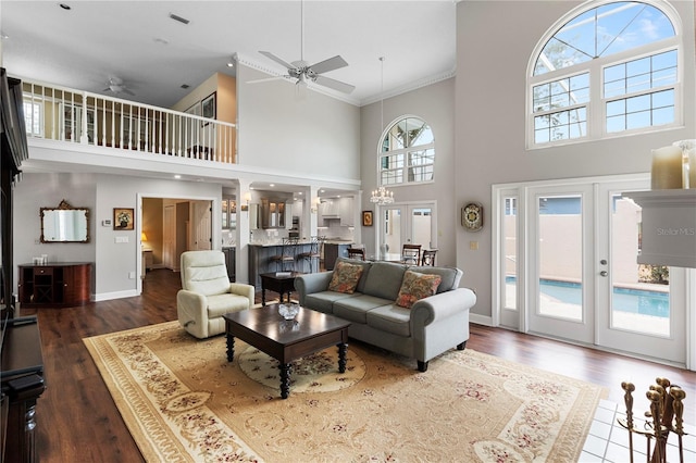 living room with french doors, ceiling fan, and dark hardwood / wood-style floors