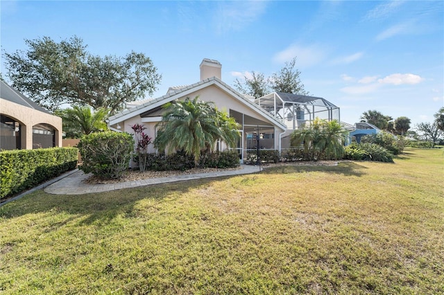 view of front of property with a lanai and a front yard