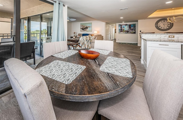 dining area featuring dark hardwood / wood-style floors