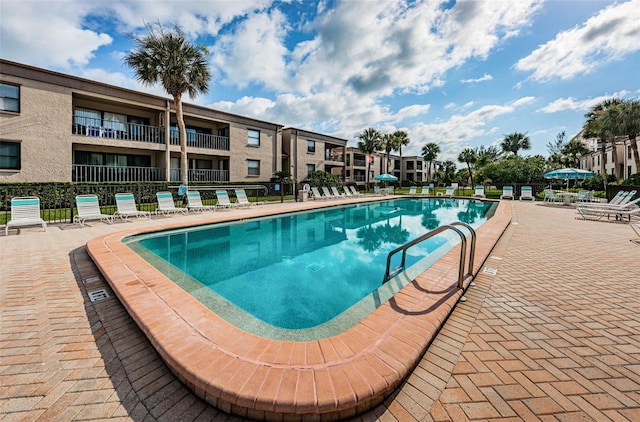 view of swimming pool with a patio