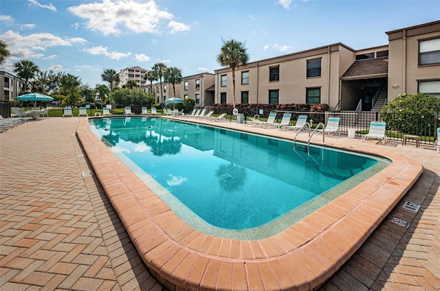 view of swimming pool with a patio