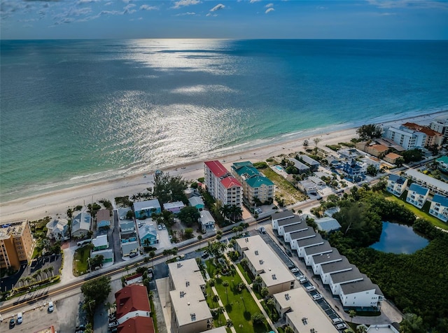 bird's eye view featuring a water view and a view of the beach