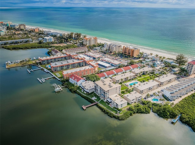 bird's eye view featuring a beach view and a water view