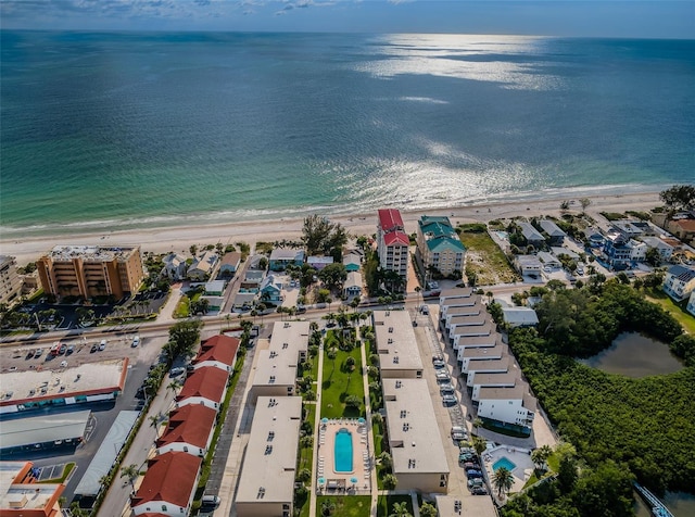 bird's eye view featuring a beach view and a water view