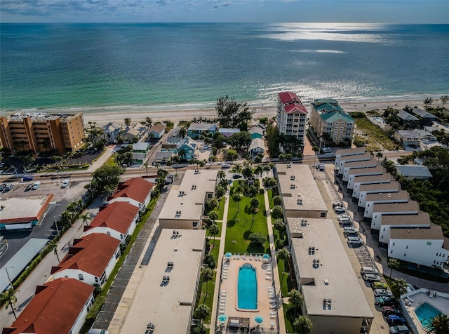 birds eye view of property featuring a water view and a view of the beach