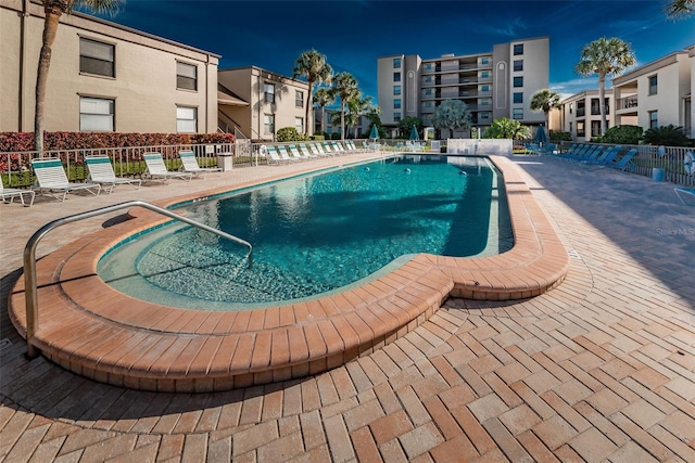 view of swimming pool with a patio area