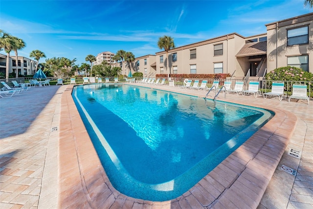 view of swimming pool with a patio