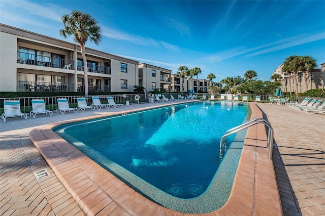 view of swimming pool featuring a patio