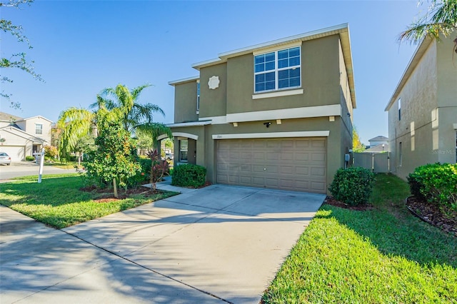 view of front of house with a front yard and a garage