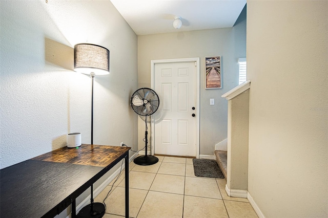 foyer featuring light tile patterned floors