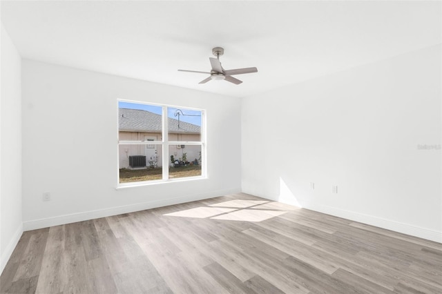 spare room with light hardwood / wood-style flooring and ceiling fan